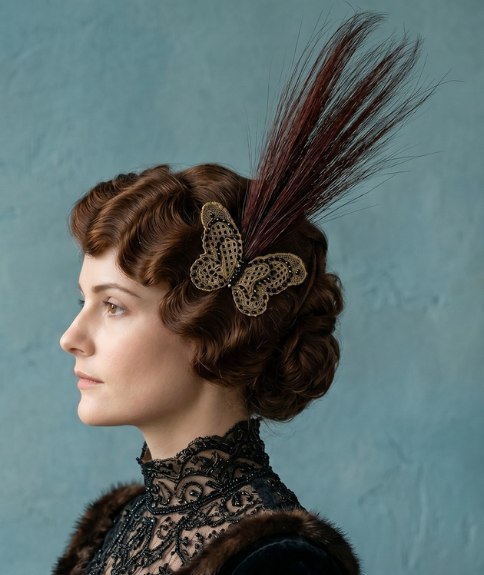 Updo with dark feathers