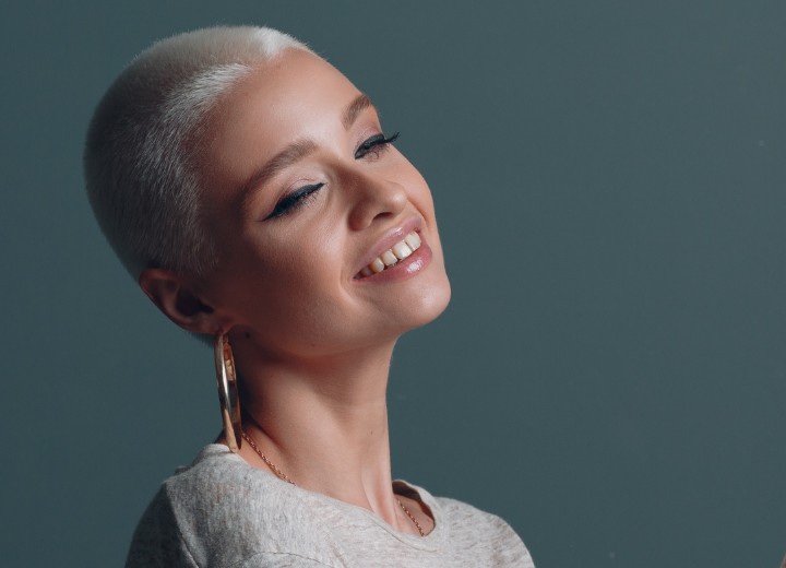 Woman with extremely short bleached hair