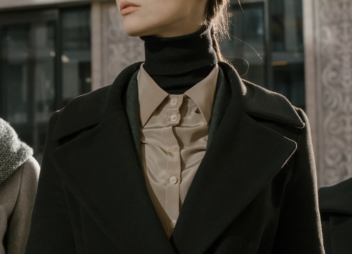 Turtleneck paired with a shiny silk blouse
