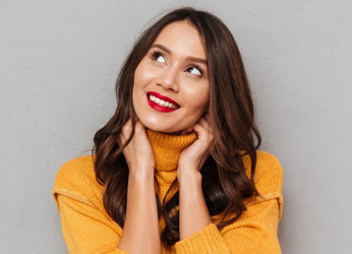 Happy young woman wearing a yellow turtleneck