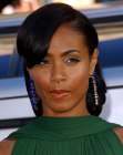 Jada Pinkett Smith with her hair gathered in the back