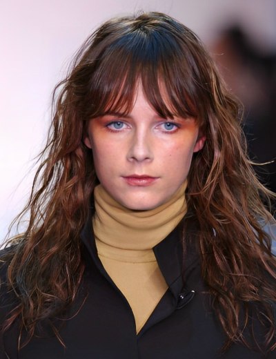 Long blunt-cut hair with deep brow-length bangs