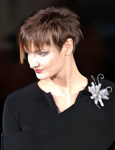 gamine short haircut with the hair cut in a wedge around the ear