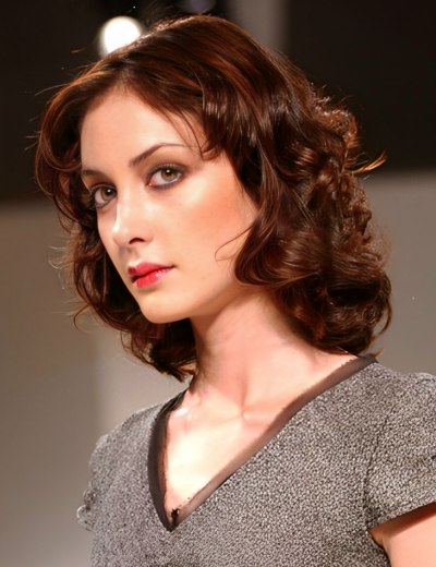 Medium length slightly above the shoulders hair with curls