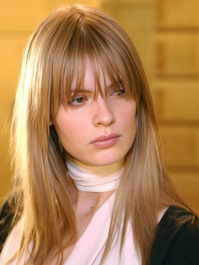 Silky straight long hairstyle with a fringe that falls below the eyes