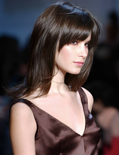 Long hairstyle with a thick fringe to draw attention to 