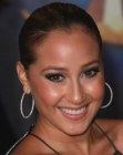 Adrienne Bailon with her sleek hair pulled back