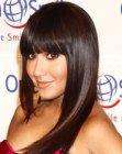 Adrienne Bailon's silky long brown hair wit blunt bangs