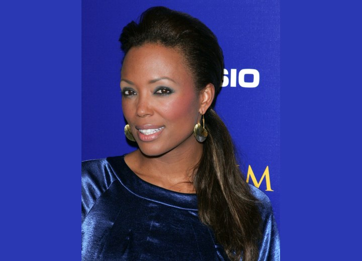 Aisha Tyler's glam hairstyle with a ponytail