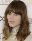 Alexa Chung with her long hair styled for a messy and unkempt look