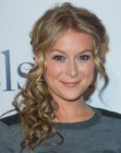 Alexa Vega's formal hairstyle with curls and a middle part