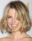 Ali Larter with her hair cut blunt below the chin in a wavy bob