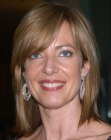 Allison Janney wearing her hair in a sleek medium length shag with bangs