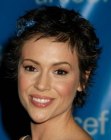 Alyssa Milano with short dark hair going slightly over her ears