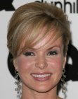 Amanda Holden's smooth updo with bangs