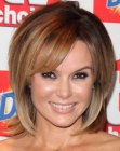 Amanda Holden rocking a medium length shag hairstyle with side bangs