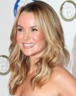 Amanda Holden's beach look with curled blonde hair