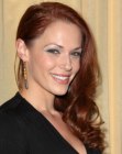 Amanda Righetti with her long hair styled over one shoulder
