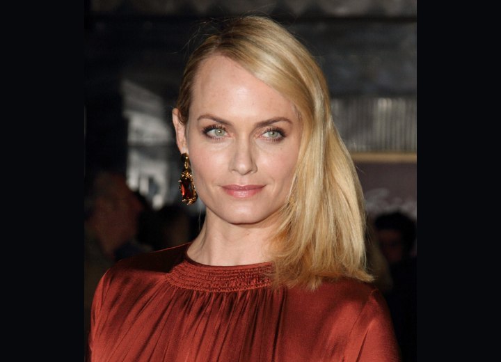 Amber Valletta wearing her hair to one side to reveal one ear