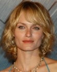 Amber Valletta's shag-inspired medum length hairstyle with bangs