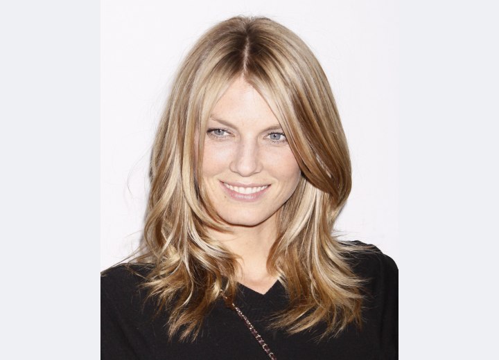 Angela Lindvall wearing her long hair centered in the middle