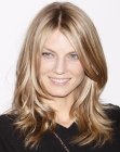 Angela Lindvall's middle-parted hair with curled ends