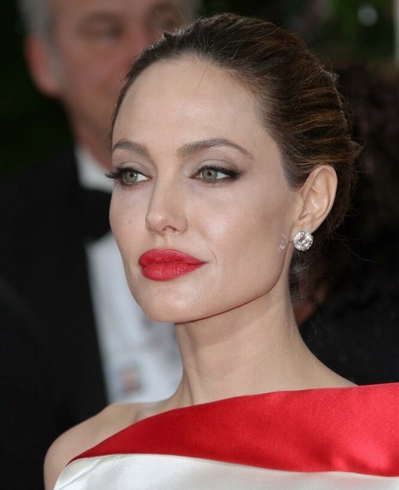 Angelina Jolie's hair styled into a simple and elegant up-do with a bun