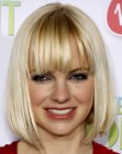 Anna Faris wearing a medium length bob with angled sides and a shorter neck section
