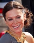 Anna Friel with her thick long hair styled up