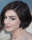 Anne Hathaway wearing her hair in a short wavy bob