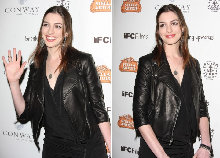 Anne Hathaway with her long hair brought into the back