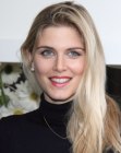 Ashley James wearing long and wavy blonde hair with highlights
