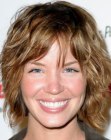 Ashley Scott wearing her hair in a shag with bangs
