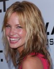 Ashley Scott's long shag hairstyle with multiple tones