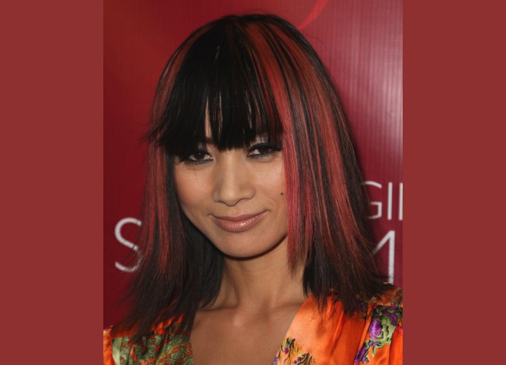 Bai Ling's hair open in a long black bob with pink streaks