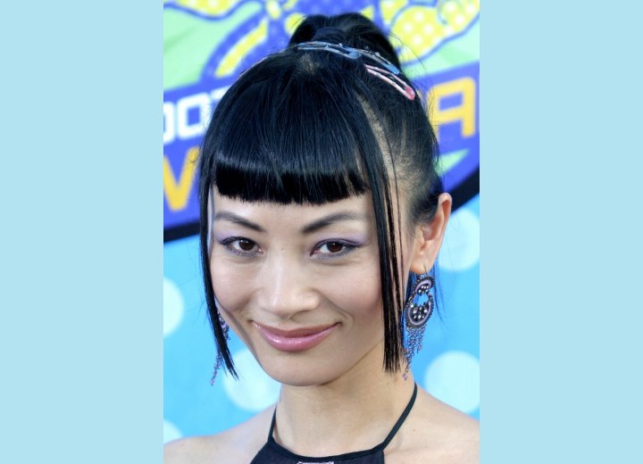 Bai Ling's strict short bangs and her Asian hair styled into a high ponytail
