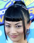 Asian actress Bai ling wearing her hair with short bangs in a high ponytail