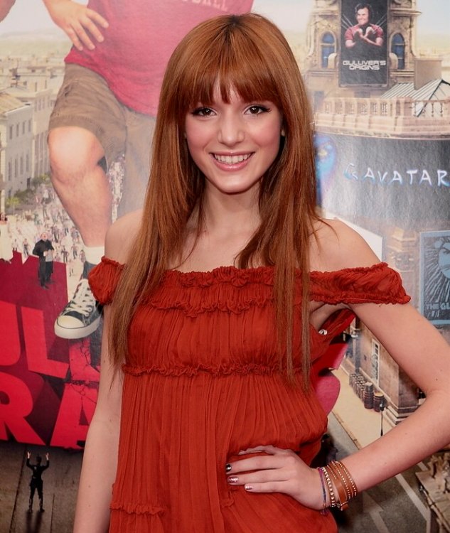 Bella Thorne's long red hair and thick bangs