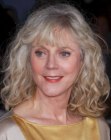 Blythe Danner's mid-length hairstyle with volume and bangs