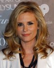 Bonnie Somerville wearing her hair long with layers and curls