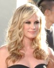 Bonnie Somerville's blonde hair with curls that plunge below the shoulders