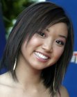 Brenda Song with choppy razor cut medium length hair