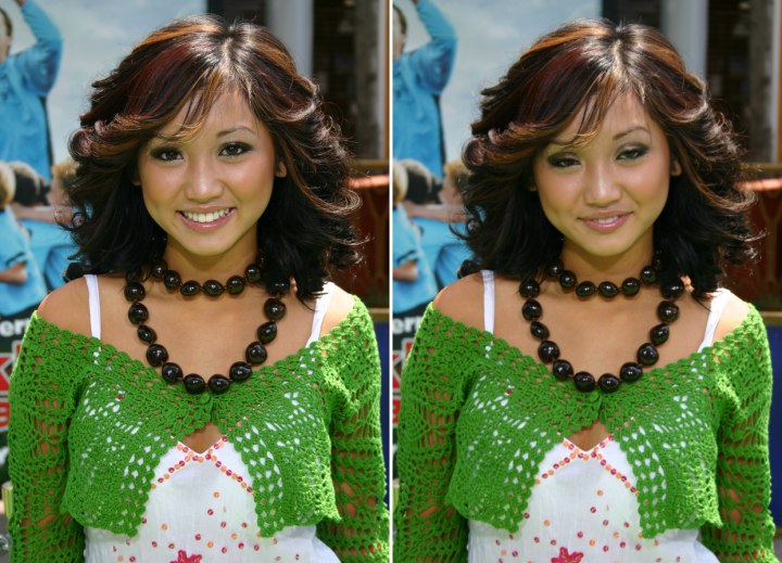Brenda Song wearing her hair curled and feathered back