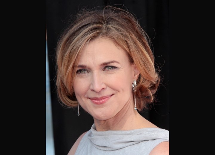 Brenda Strong wearing a dress with a scarf like collar