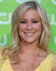Brittany Daniel sporting long and softly curled hair