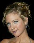 Brittany Snow wearing her hair in an updo with a bun