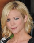 Brittany Snow's medium length bob with her hair on one side tucked behind her ear