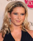 Brooke Kinsella sporting a long hairstyle with side braids