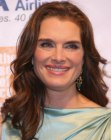Brooke Shields aged over 40 and wearing long hair with loose curls