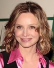 pink satin blouse wearing Calista Flockhart